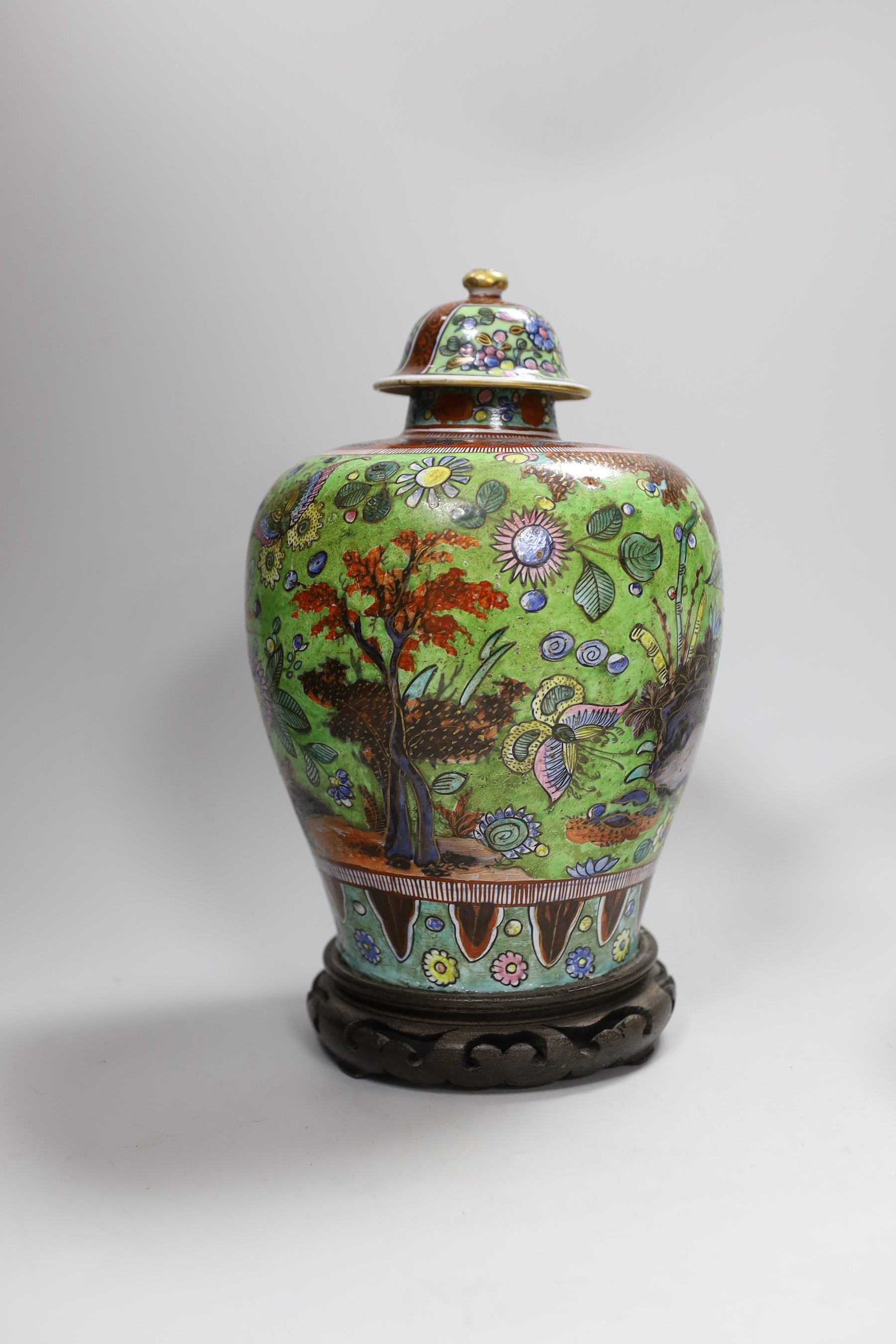 A Chinese clobbered vase and cover, and a blanc de chine bowl and cover, tallest 30cms high (2)